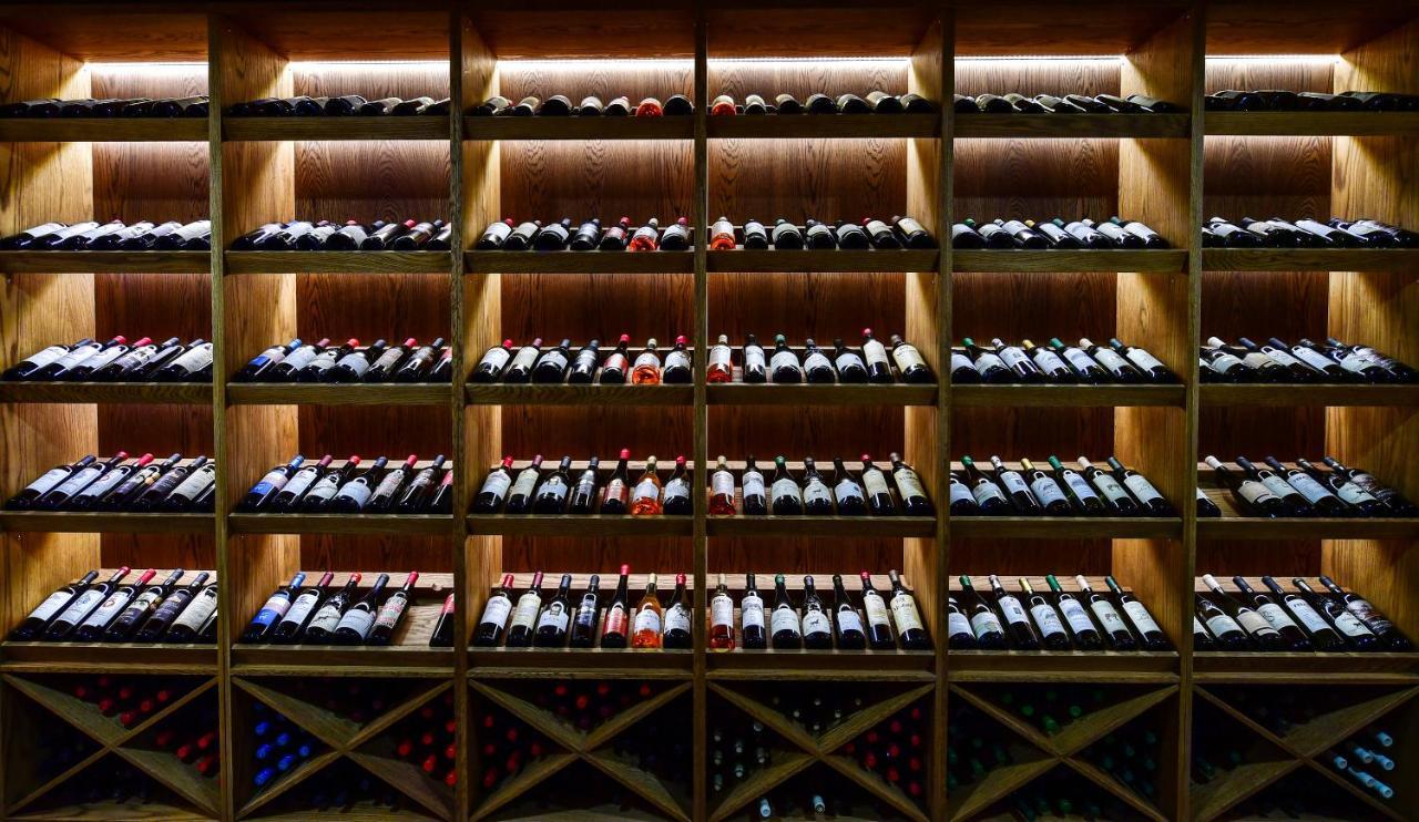 Gudauri Lodge Exterior foto Wine bottles in a wine rack